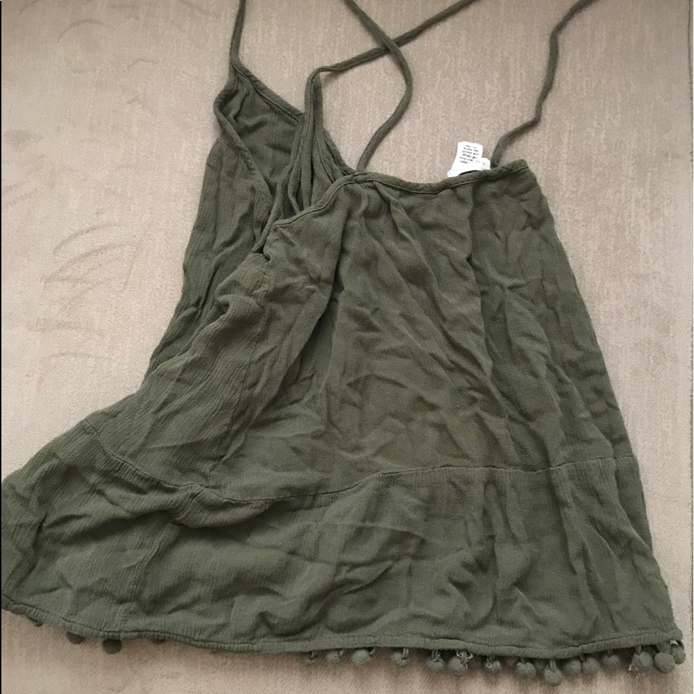 Cute tank with Pom detailing on bottom